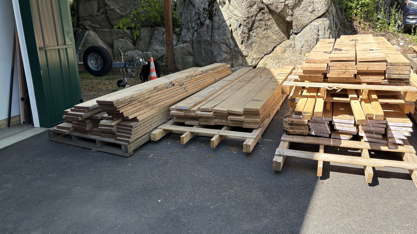 Stacks of rough-sawn oak deck and trailer decking boards milled at Pop's Barn